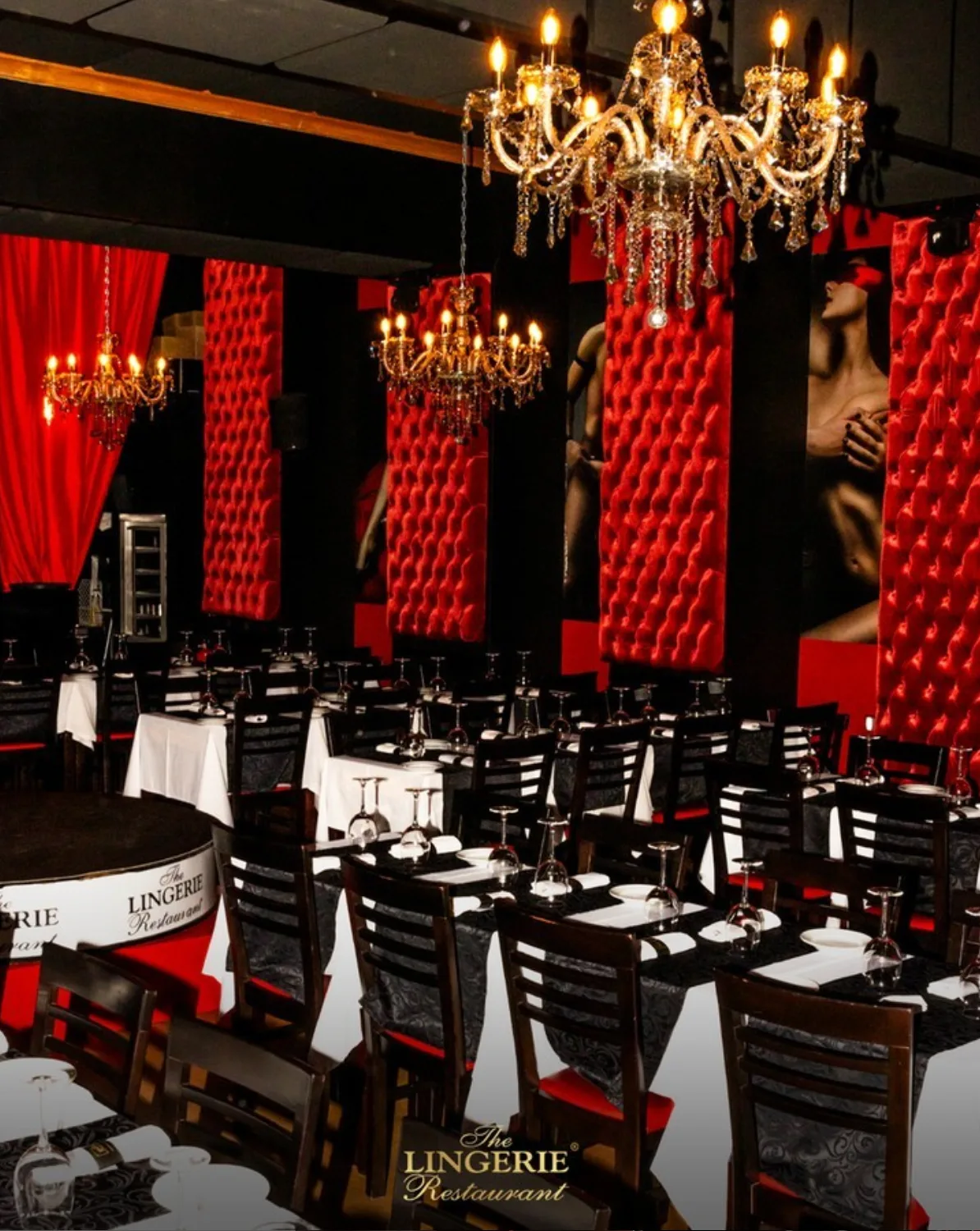 The red-and-black dining room at The Lingerie Restaurant set for dinner