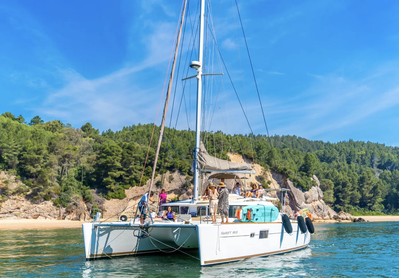 Private boat cruising beneath the cliffs of Arrábida